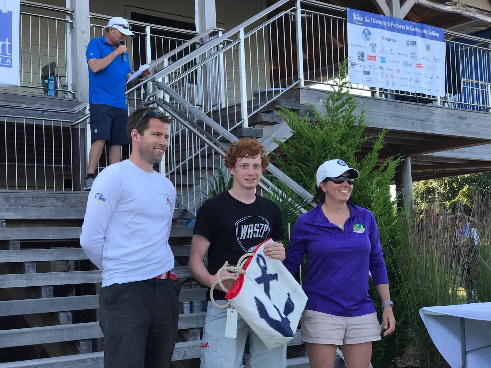 Ben receiving a trophy with Matt Duggan and Lynn Lynch